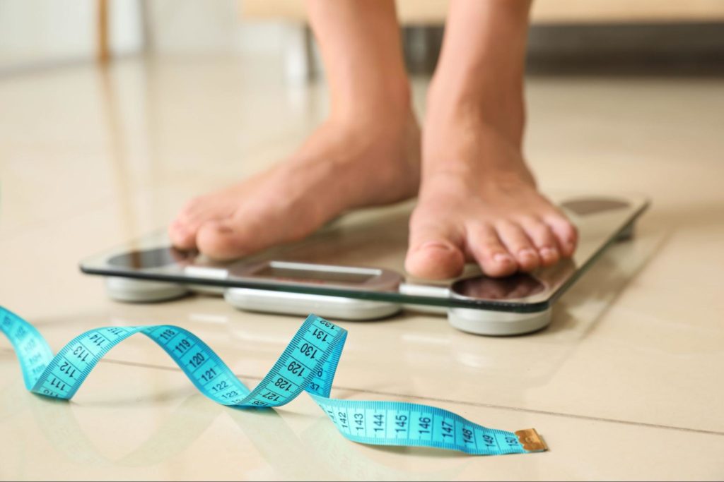Person using a scale
